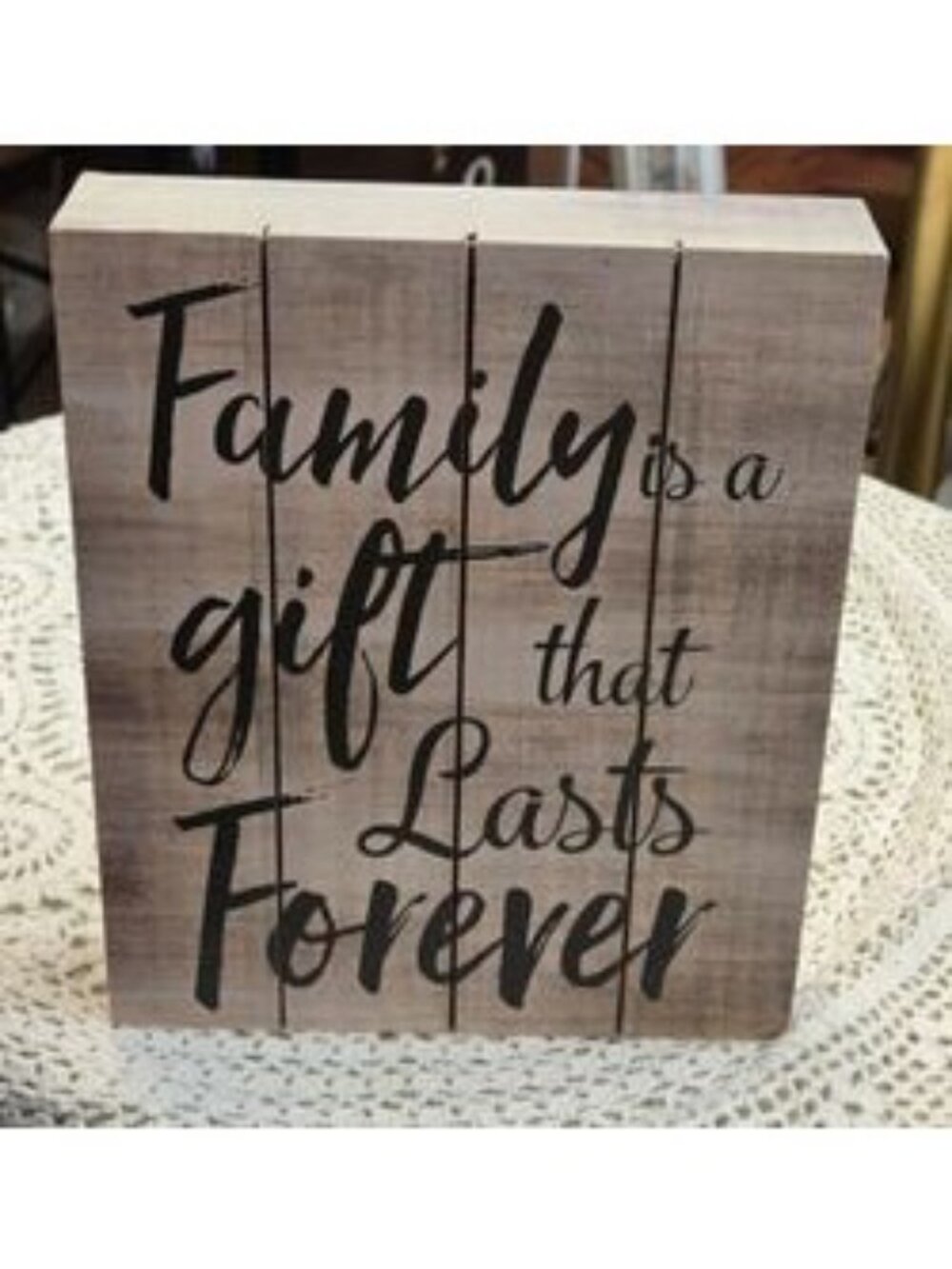 At home plaque with saying